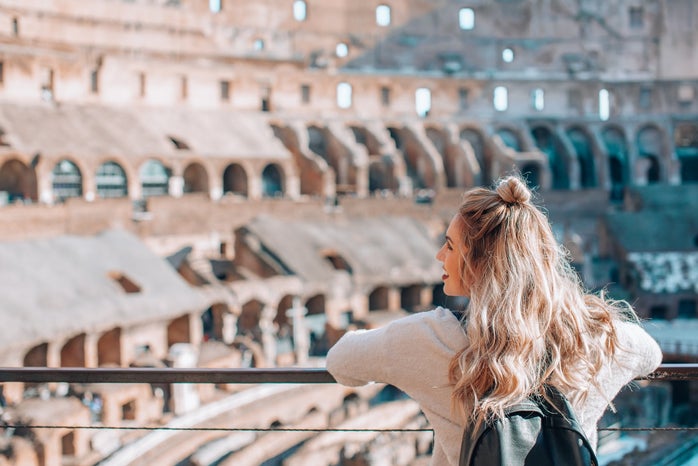 Woman visiting the Colosseum in Rome Italy by Courtney Cook via Unsplash?width=698&height=466&fit=crop&auto=webp&dpr=4